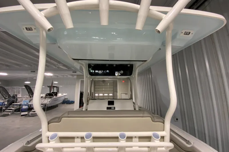 Slide: The Image of 2024 Key West 263 FS boat interior, featuring seating and storage compartments. - 29