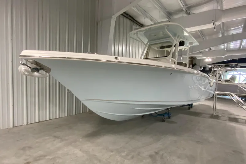 Slide: The Image of 2024 Key West 263 FS boat in showroom, side view. - 3