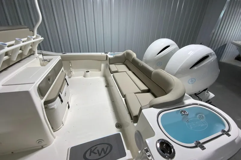 Slide: The Image of 2024 Key West 263 FS boat interior with seating and twin engines. - 4
