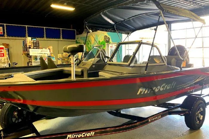 Slide: The Image of 2023 MirroCraft 176 Dual Impact boat in showroom. - 15