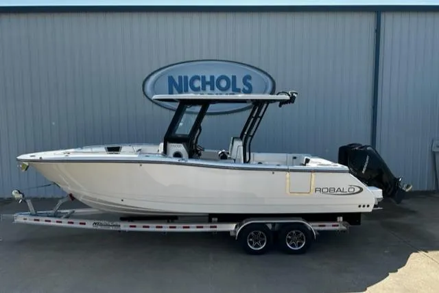 Slide: The Image of 2023 Robalo R270 boat on trailer at Nichols dealership. - 0