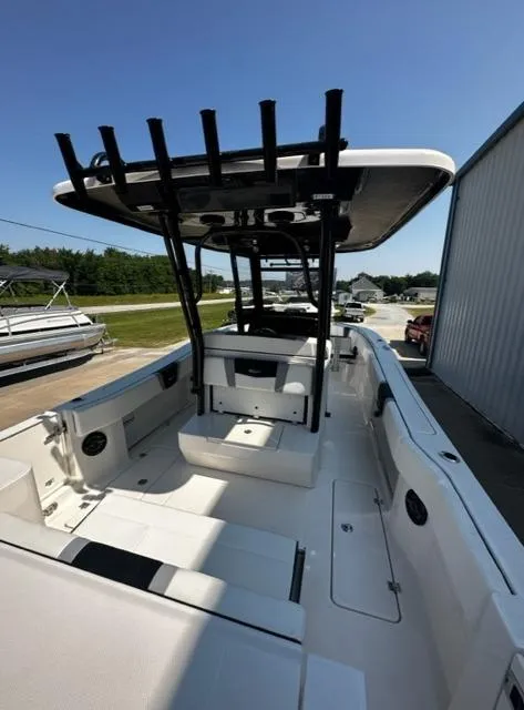 Slide: The Image of 2023 Robalo R270 boat interior with T-top and seating. - 10
