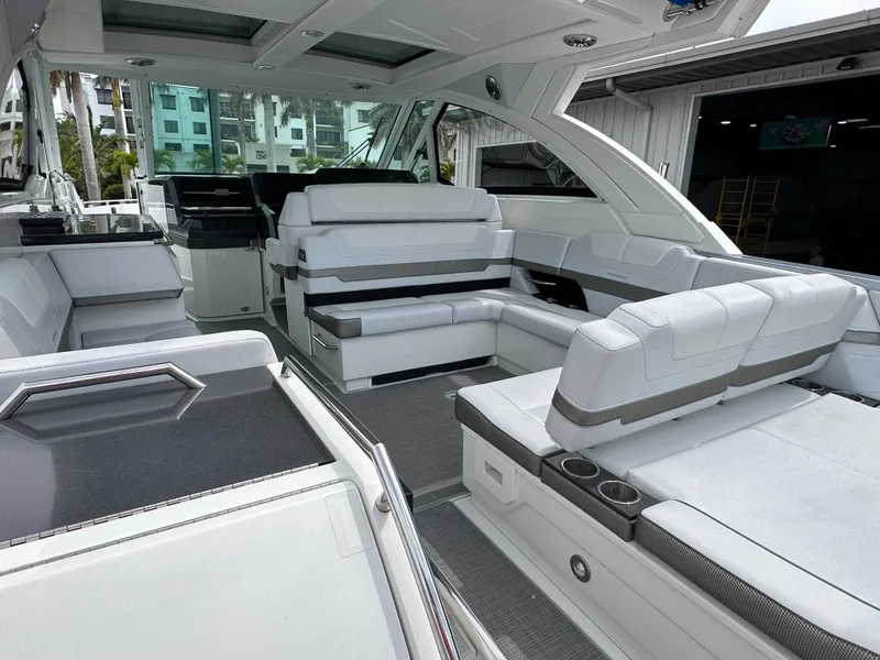 Slide: The Image of 2021 Formula 380 SSC boat interior with spacious seating and cup holders. - 14