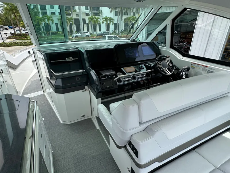 Slide: The Image of 2021 Formula 380 SSC luxury boat interior with white seating and modern design. - 16