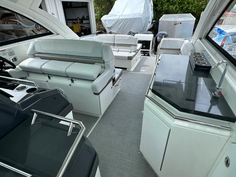 Slide: The Image of 2021 Formula 380 SSC boat cockpit with modern navigation system and white seating. - 18