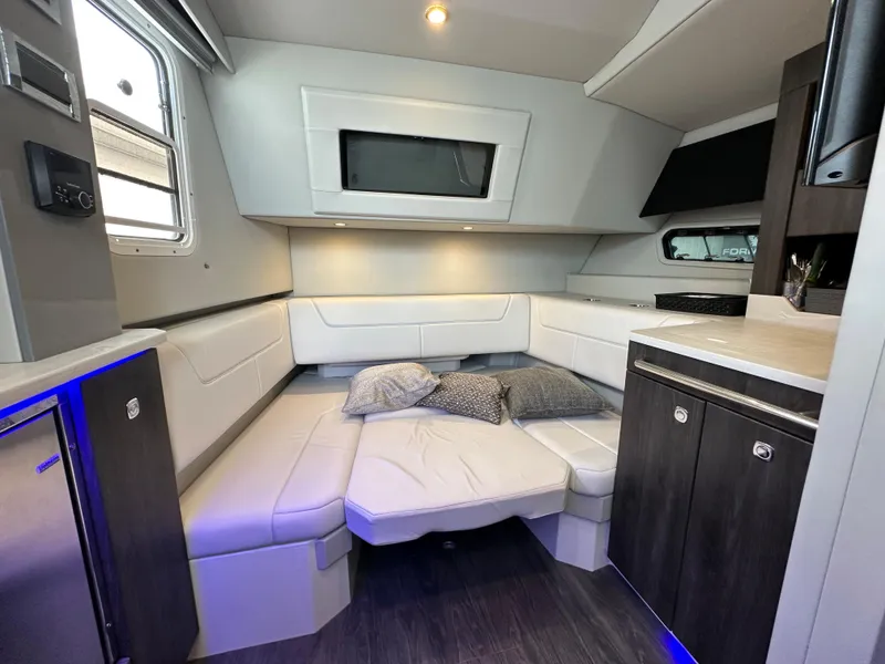 Slide: The Image of 2021 Formula 380 SSC boat interior with spacious white seating. - 23