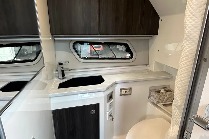 Slide: The Image of 2021 Formula 380 SSC boat interior with modern kitchenette and window. - 30