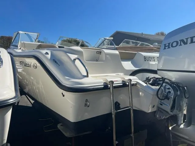 Slide: The Image of 2018 Key West 239 DFS boat with Honda outboard motor in a marina. - 4