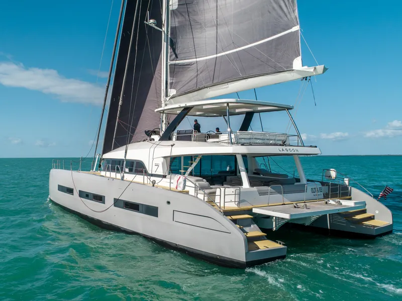 Slide: The Image of 2020 Lagoon SEVENTY 7 yacht sailing on open sea with clear skies. - 11