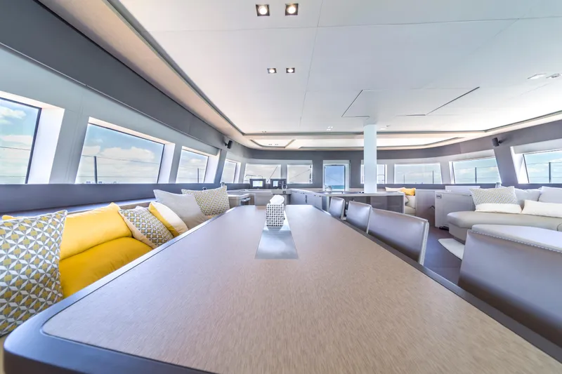 Slide: The Image of Luxurious interior of 2020 Lagoon SEVENTY 7 yacht with modern seating and large windows. - 33
