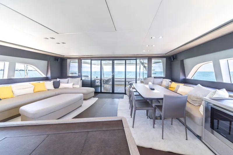Slide: The Image of Luxurious interior of 2020 Lagoon SEVENTY 7 yacht with modern seating and dining area. - 35