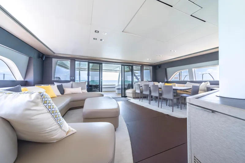Slide: The Image of Luxurious interior of 2020 Lagoon SEVENTY 7 yacht with modern seating and dining area. - 38