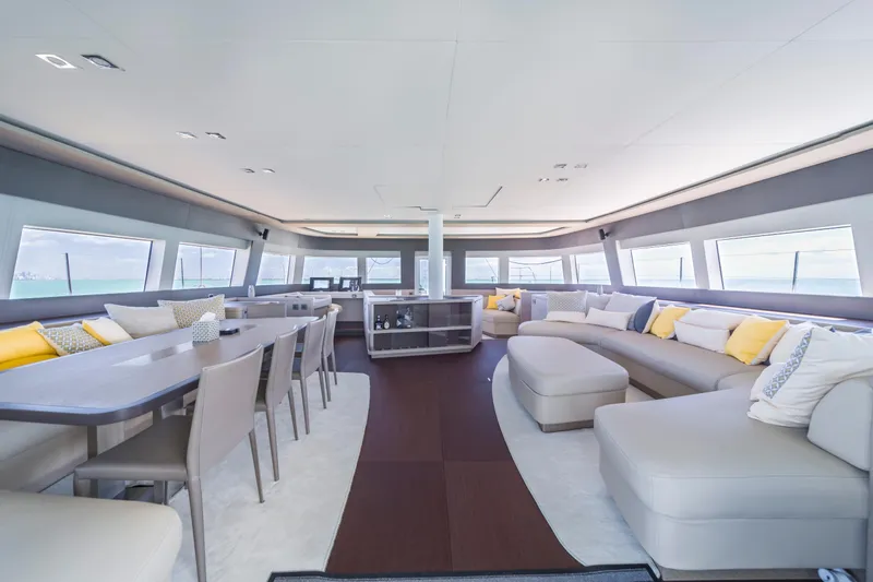 Slide: The Image of Luxurious interior of 2020 Lagoon SEVENTY 7 yacht with modern seating and panoramic windows. - 43
