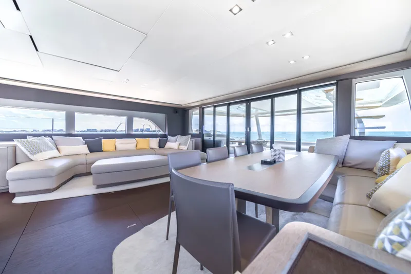 Slide: The Image of Luxurious interior of 2020 Lagoon SEVENTY 7 yacht with modern seating and dining area. - 44
