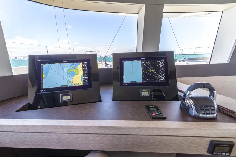 Slide: The Image of Navigation system on 2020 Lagoon SEVENTY 7 yacht with dual screens and controls. - 45