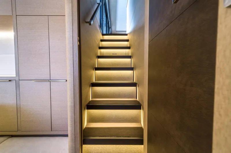 Slide: The Image of Interior staircase of 2020 Lagoon SEVENTY 7 yacht with modern lighting. - 49