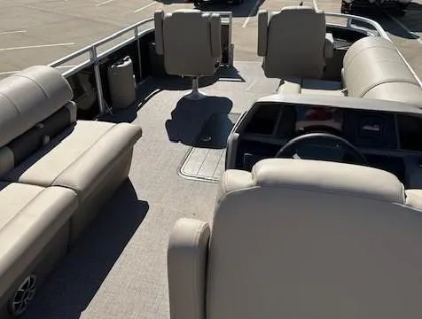 Slide: The Image of 2023 Sun Tracker Sportfish 24 XP3 pontoon boat interior with beige seating. - 4