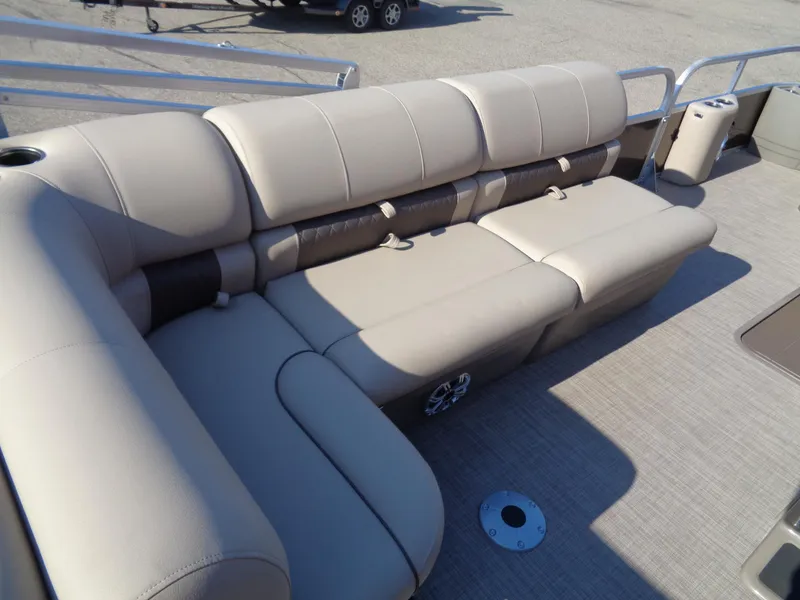 Slide: The Image of 2023 Sun Tracker Sportfish 24 XP3 pontoon boat with beige seating. - 10