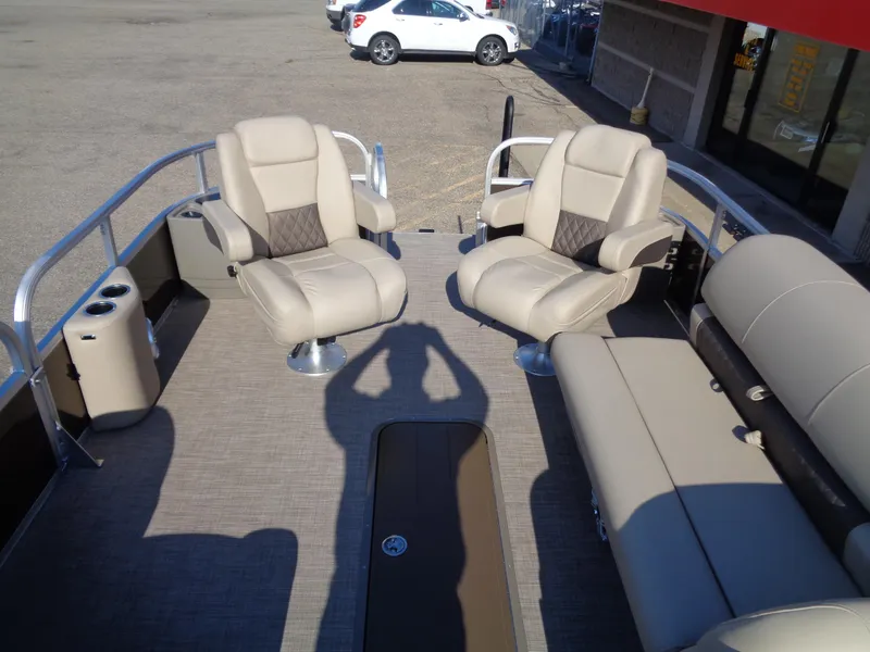 Slide: The Image of 2023 Sun Tracker Sportfish 24 XP3 pontoon boat interior with beige seating. - 7