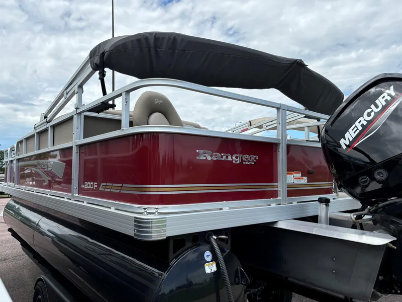 Slide: The Image of 2023 Ranger Reata 200F pontoon boat with Mercury outboard motor. - 3