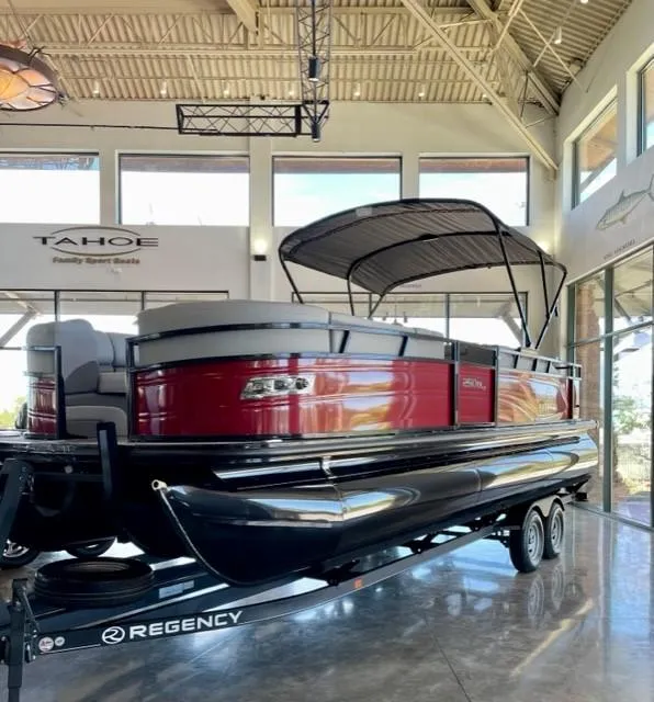Slide: The Image of 2023 Regency 250 DL3 pontoon boat on display in showroom. - 8