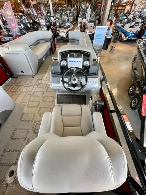 Slide: The Image of 2023 Regency 250 DL3 boat interior with captain's chair and control console. - 9