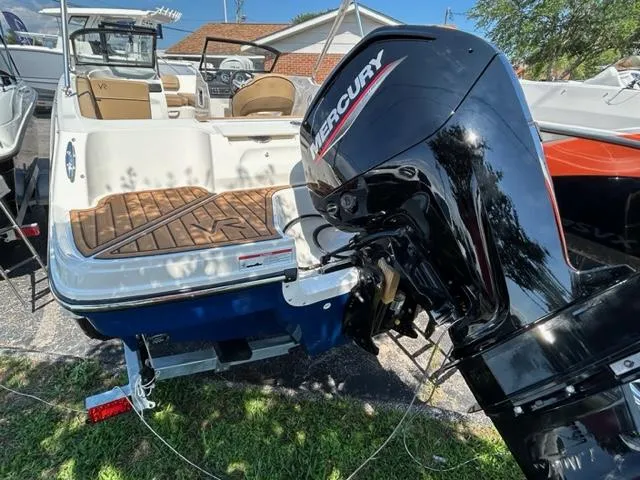 Slide: The Image of 2024 Bayliner VR4 boat with Mercury outboard motor, rear view. - 3