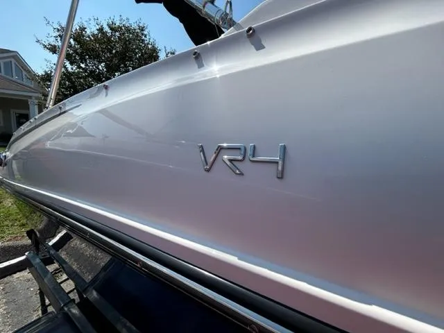 Slide: The Image of 2024 Bayliner VR4 boat side view with VR4 emblem. - 5