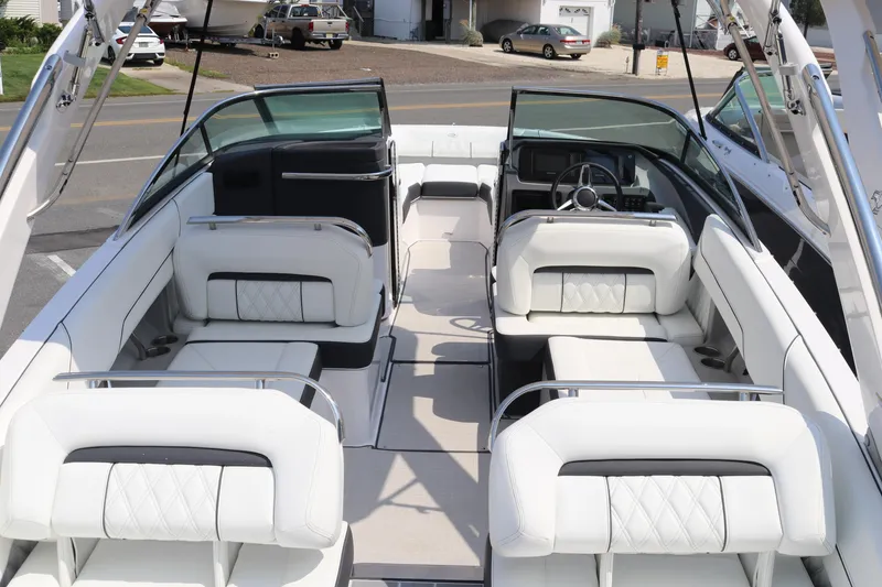 Slide: The Image of 2023 Regal LS6 boat interior with luxurious white seating and modern design. - 21