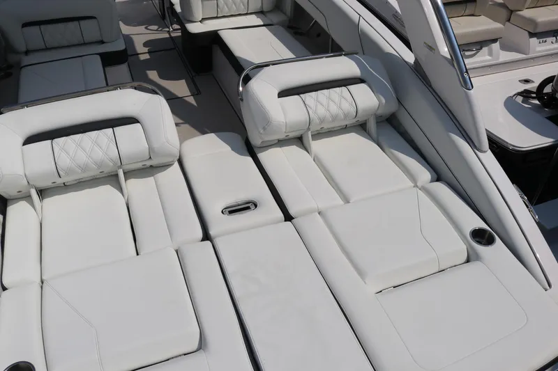 Slide: The Image of Luxurious seating on 2023 Regal LS6 boat with white upholstery and adjustable headrests. - 26