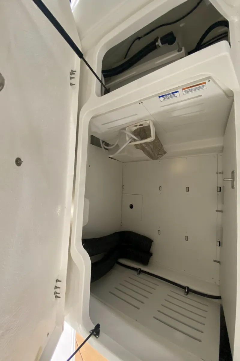 Slide: The Image of 2024 Bayliner DX2000 storage compartment interior view - 14