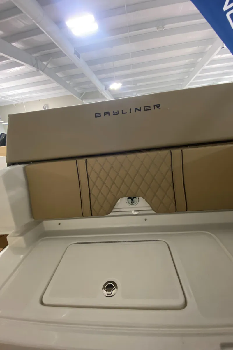 Slide: The Image of 2024 Bayliner DX2000 boat interior with storage compartment. - 9