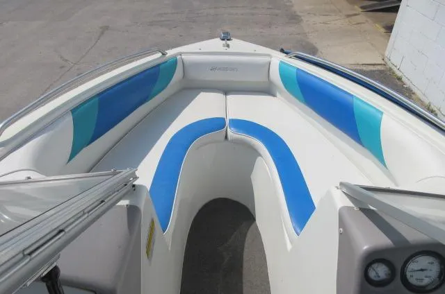 Slide: The Image of 1993 Rinker 186 Captiva boat interior with blue and white seating. - 10