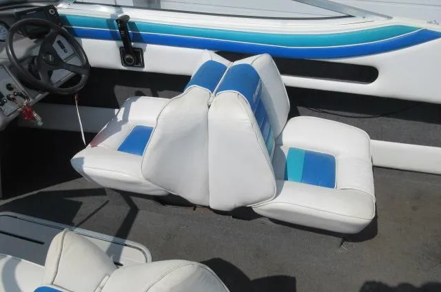 Slide: The Image of Interior seating of a 1993 Rinker 186 Captiva boat with blue and white upholstery. - 6