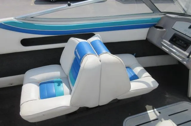 Slide: The Image of Interior seating of a 1993 Rinker 186 Captiva boat with blue and white upholstery. - 7