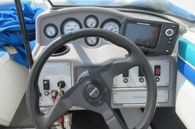 Slide: The Image of 1993 Rinker 186 Captiva boat dashboard with steering wheel and gauges. - 9