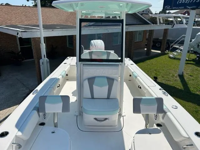 Slide: The Image of 2024 Robalo 246 Cayman center console boat with seating and storage. - 13