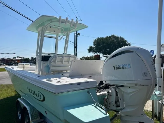 Slide: The Image of 2024 Robalo 246 Cayman boat with Yamaha engine, side view. - 3