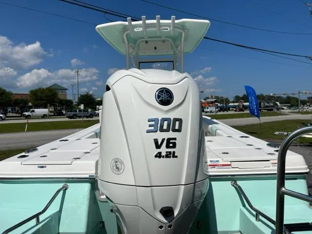 Slide: The Image of 2024 Robalo 246 Cayman boat with Yamaha 300 V6 4.2L engine. - 4