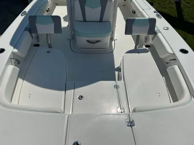 Slide: The Image of 2024 Robalo 246 Cayman boat interior with seating and storage compartments. - 12