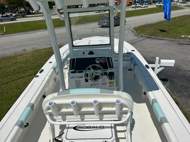 Slide: The Image of 2024 Robalo 246 Cayman center console boat with helm and seating. - 7