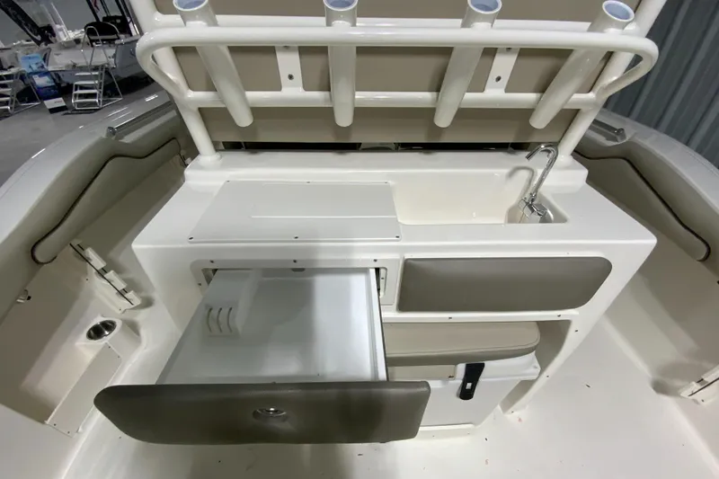Slide: The Image of 2024 Key West 263 FS boat interior with storage compartments and sink. - 11