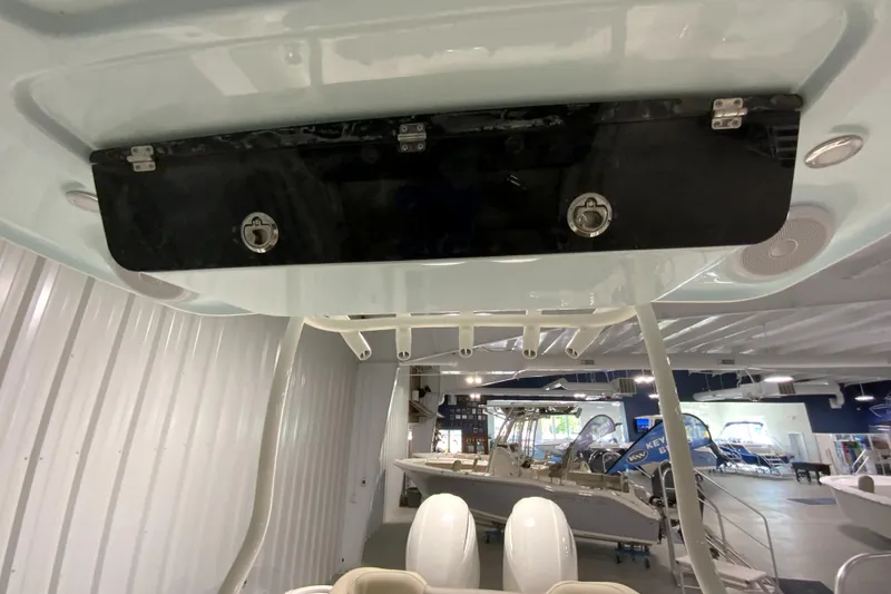 Slide: The Image of 2024 Key West 263 FS boat interior with overhead storage compartment. - 16