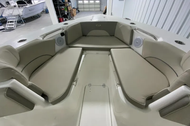 Slide: The Image of 2024 Key West 263 FS boat interior with cushioned seating in a storage facility. - 19