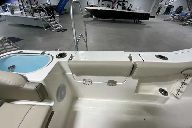Slide: The Image of 2024 Key West 263 FS boat interior with seating and storage compartments. - 27