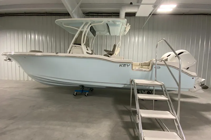 The Image of 2024 Key West 263 FS boat in indoor storage with access stairs. - 1