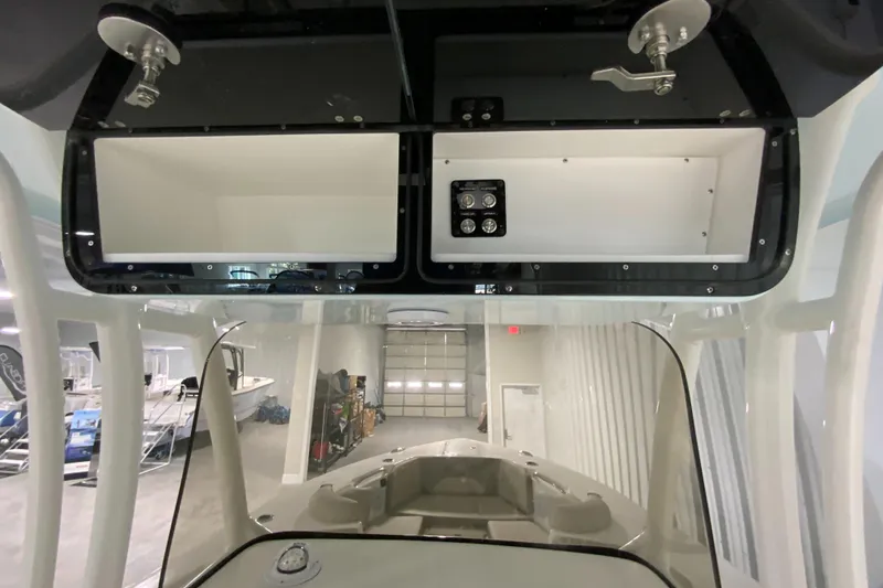 Slide: The Image of 2024 Key West 263 FS boat interior storage compartments and control panel. - 15