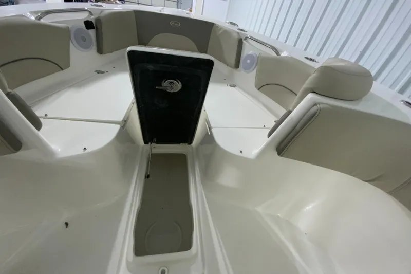 Slide: The Image of 2024 Key West 263 FS boat interior with seating and storage compartments. - 23