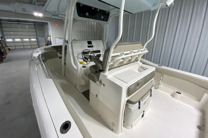 Slide: The Image of 2024 Key West 263 FS boat interior with center console and seating. - 5