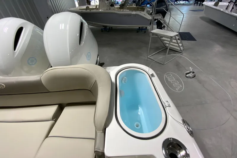 Slide: The Image of 2024 Key West 263 FS boat interior with seating and livewell. - 8